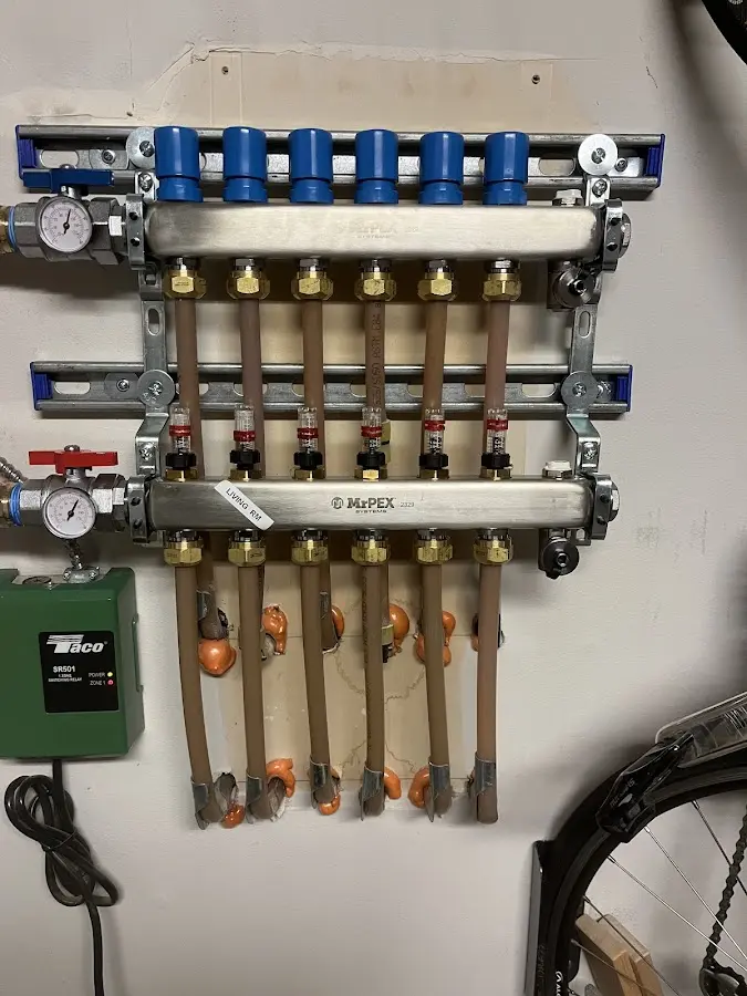 Plumber performing Water Heater Repair at a residential property in Novi